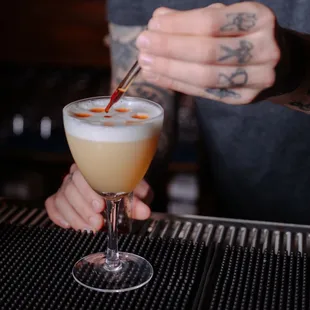 a bartender mixing a drink