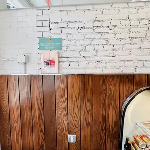 a kitchen with wood paneling