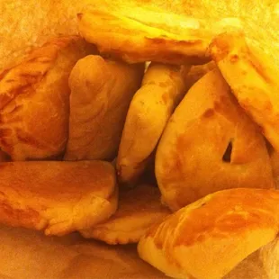 Bag of empanadas; pineapple, cherry &amp; apple.