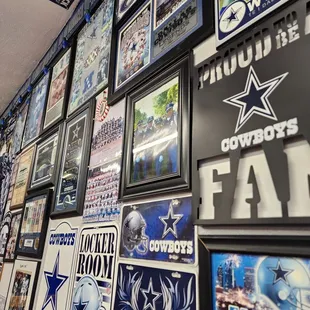 a wall of football memorabilia