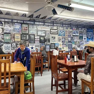 people sitting at tables in a restaurant