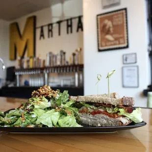 The King's Around:  Free range smoked turkey, peppered bacon, roasted tomato, pickled onion, greens, stone ground mustard and mayo on rye.