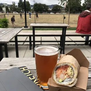 I bought some food from down the street. Grabbed a beer. Hanging out while watching dogs run around.