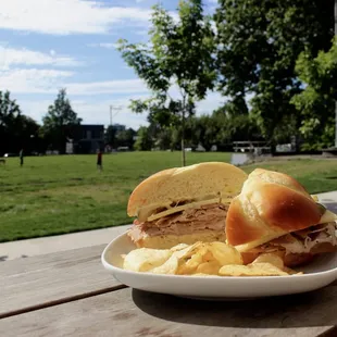 The Left Bower: Olympic Provisions ham and Capicola, extra sharp cheddar, dill pickles, stone ground mustard and mayo on a brioche roll.