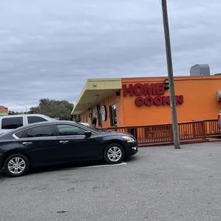 a car parked in front of the restaurant