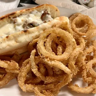 Cheesesteak with homemade onion rings.