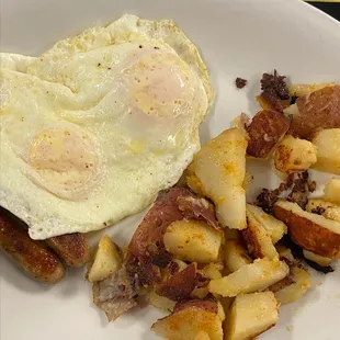 My husbands over easy eggs (I gave him my 2 eggs also), home fries and sausage links | Martha's Family Restaurant | Seffner FL