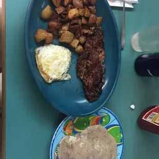 2 egg over well, Corned Beef Hash, potatoes, and biscuits with sausage gravy. Hash was not good.