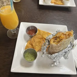 Breakfast burrito with chorizo and potatoes Fresh squeezed orange juice