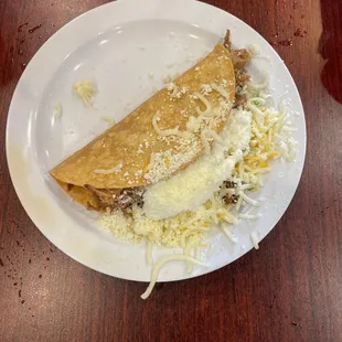 Crispy carnitas taco without lettuce or pico