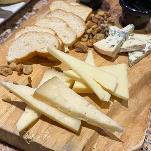 cheese and crackers on a cutting board