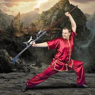 Martial Artistry Shaolin Kung Fu and Chinese Wushu student Jonathan Milton poses with the horse cutter, a Chinese martial arts weapon.