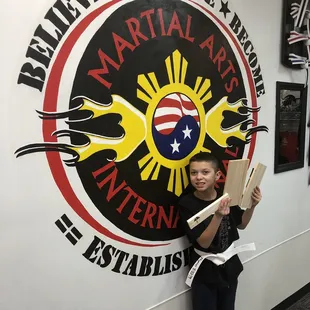 Proud of his board breaking experience!