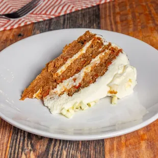 a slice of carrot cake on a plate