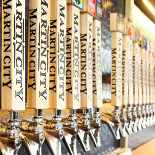 a row of beer taps