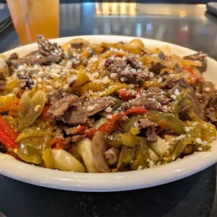 Philly Cheesesteak Mac - Philly beef, mushrooms, roasted pepper medley, roasted yellow onions