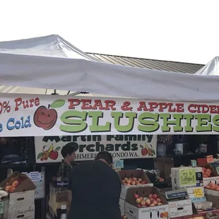 a fruit stand at a farmers market