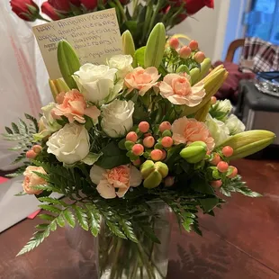 White and peach Bouquet in foreground (roses in back were from Costco my husband threw in a vase) :)