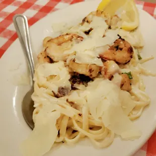 a plate of pasta and chicken