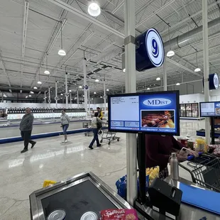 people shopping in a grocery store