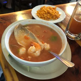 a bowl of soup and a plate of rice