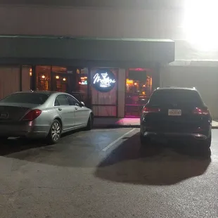 two cars parked in a parking lot