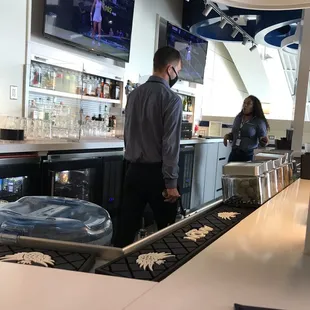 a man and a woman at the bar
