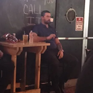 two men sitting at a table