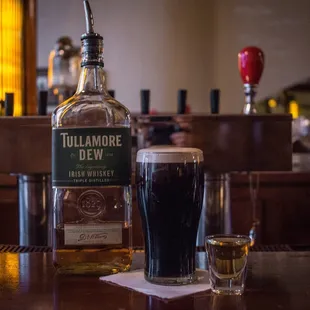 a bottle and two glasses