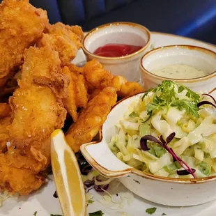 Fish and Chips.  3 big chunks of cod and tasty waffle fries.  Excellent