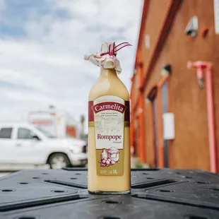 a bottle of mustard sitting on a table