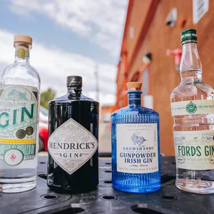 a selection of gin bottles on a table