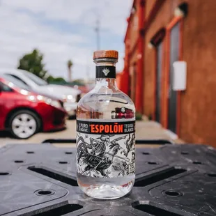 a bottle of espilon on a table