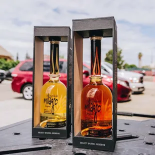 two bottles of bourbon on a table