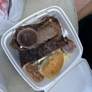 ribs and beans in a styrofoam container