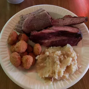 a plate of meat and potatoes