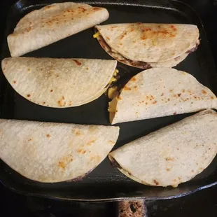 tortillas cooking in a skillet