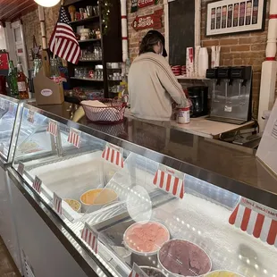 a woman behind the counter