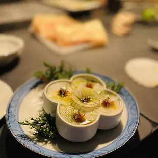 three bowls of soup on a plate