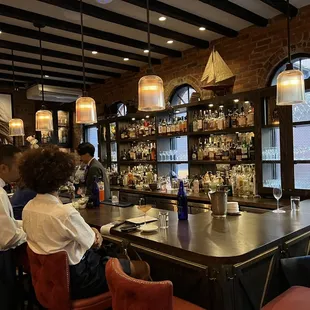 people sitting at a bar