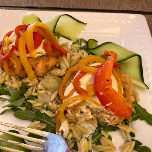 Salmon cake over Orzo and artichokes.
