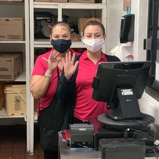 two women wearing face masks