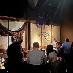 a group of people sitting around a table