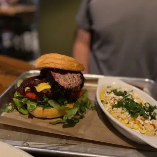 Bacon burger with brisket, and side of corn