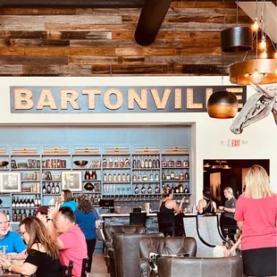 people sitting at tables in a coffee shop