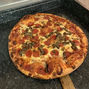 Large pepperoni mushroom pizza
