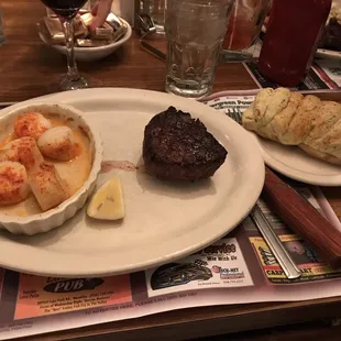 Filet with broiled scallops and a twice baked potato