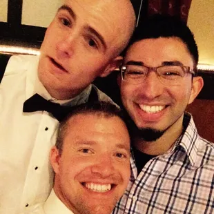 three men posing for a picture