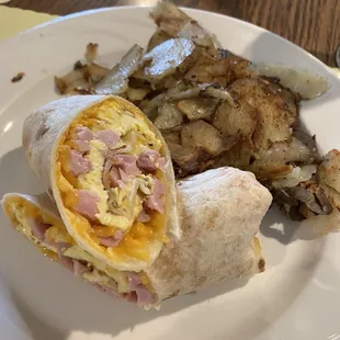 Breakfast burrito with side of home fries