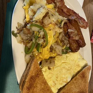 Breakfast platter with peppers , onions, &amp; cheese added to the potatoes